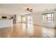 Spacious living room features tile flooring, ceiling fan, and sliding door access to the backyard at 7829 Lovely Pine Pl, Las Vegas, NV 89143