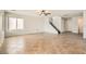 Spacious living room with tile flooring and a staircase at 7829 Lovely Pine Pl, Las Vegas, NV 89143
