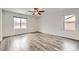 Spacious main bedroom featuring wood-look flooring and a view at 7829 Lovely Pine Pl, Las Vegas, NV 89143