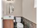 This powder room has slate walls and a modern vanity at 7865 Solid Horn Ct, Las Vegas, NV 89149