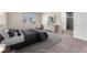 This bedroom features lots of natural light and a plush carpet at 7865 Solid Horn Ct, Las Vegas, NV 89149