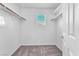 This closet has a window, carpeted floors, and built-in shelving at 7865 Solid Horn Ct, Las Vegas, NV 89149