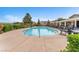 Sparkling community pool with ample seating and lush landscaping for residents to enjoy at 7865 Solid Horn Ct, Las Vegas, NV 89149