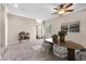 This dining area has seating for six, an updated ceiling fan, and great lighting at 7865 Solid Horn Ct, Las Vegas, NV 89149