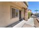 Front of home with stone accents, a small porch, and desert landscaping in a suburban neighborhood at 7865 Solid Horn Ct, Las Vegas, NV 89149