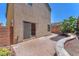 Private outdoor patio with pavers, landscaping, and a sliding glass door to the home's interior at 7865 Solid Horn Ct, Las Vegas, NV 89149