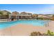 Community pool with plenty of lounge chairs and tables, perfect for relaxation at 7865 Solid Horn Ct, Las Vegas, NV 89149