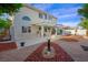 Expansive backyard with patio area, rock landscaping, and wrought iron gate access at 9021 Canyon Magic Ave, Las Vegas, NV 89129