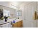 Clean bathroom with a single sink vanity and mirrored medicine cabinet at 9021 Canyon Magic Ave, Las Vegas, NV 89129