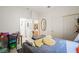 Inviting bedroom with a cozy bed, a quaint desk, and ample storage for a comfortable living space at 9021 Canyon Magic Ave, Las Vegas, NV 89129