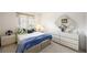 Bright bedroom with geometric decor, cozy bedding, and ample natural light from the window at 9021 Canyon Magic Ave, Las Vegas, NV 89129