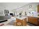 Open kitchen with island, breakfast nook, and living room access at 9021 Canyon Magic Ave, Las Vegas, NV 89129
