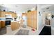 Bright kitchen with oak cabinets, central island, and black appliances at 9021 Canyon Magic Ave, Las Vegas, NV 89129