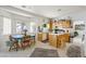 Bright kitchen and breakfast nook with lots of natural light and oak cabinets at 9021 Canyon Magic Ave, Las Vegas, NV 89129