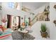 Elegant living room with high ceilings, ornate staircase, and beautiful decor create an elegant entrance at 9021 Canyon Magic Ave, Las Vegas, NV 89129