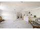 Bright loft area featuring plush carpeting, elegant decor, and versatile layout for comfortable living at 9021 Canyon Magic Ave, Las Vegas, NV 89129