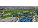Aerial community view featuring a park with walking paths, sports courts, and parking at 11640 Desert Hollow Ave, Las Vegas, NV 89138