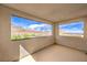 Expansive balcony offers panoramic views of the mountains and city skyline at 11640 Desert Hollow Ave, Las Vegas, NV 89138