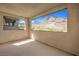 Spacious covered balcony offers stunning views of the mountains and desert landscape at 11640 Desert Hollow Ave, Las Vegas, NV 89138