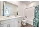 Bathroom features a double sink vanity, white tile shower and modern fixtures at 11640 Desert Hollow Ave, Las Vegas, NV 89138