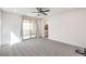 Carpeted bedroom with private balcony access at 11640 Desert Hollow Ave, Las Vegas, NV 89138