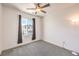 Simple bedroom offers neutral walls, carpet and a ceiling fan for comfort at 11640 Desert Hollow Ave, Las Vegas, NV 89138