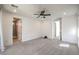 Bedroom featuring neutral carpet and ensuite bathroom at 11640 Desert Hollow Ave, Las Vegas, NV 89138