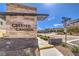 Crested Canyon community entrance with stone signage and landscaping near Lake Mead and Highland Crest street signs at 11640 Desert Hollow Ave, Las Vegas, NV 89138