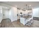 Stylish kitchen with a large center island, stainless steel appliances, and ample white cabinetry at 11640 Desert Hollow Ave, Las Vegas, NV 89138