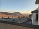 Scenic mountain view from a window showing landscaping, street, and neighboring rooftops at 11640 Desert Hollow Ave, Las Vegas, NV 89138