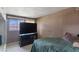 Bedroom featuring a bed, television on a console, and a window at 1643 E St, Las Vegas, NV 89106