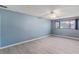 Bedroom featuring neutral walls, wood-look floors, and large window view at 1643 E St, Las Vegas, NV 89106