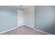 Bedroom featuring neutral walls, wood-look floors, and white sliding closet doors at 1643 E St, Las Vegas, NV 89106