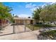 View of single-story home with fenced front yard at 1643 E St, Las Vegas, NV 89106