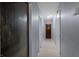 Hallway with multiple doors and light-colored laminate flooring at 1643 E St, Las Vegas, NV 89106