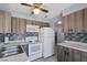 An updated kitchen with stainless steel appliances, stylish cabinets, and modern backsplash at 1643 E St, Las Vegas, NV 89106