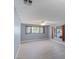 Spacious living room featuring neutral walls, wood-look floors, and large window view at 1643 E St, Las Vegas, NV 89106