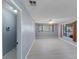 Spacious living room featuring neutral walls, wood-look floors, and large window view at 1643 E St, Las Vegas, NV 89106