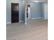 Open concept living room leads into kitchen featuring modern flooring, paint and fixtures at 1643 E St, Las Vegas, NV 89106