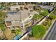Lush backyard with mature trees and a private pool area provides the perfect oasis for relaxation and entertainment at 1800 Melfi Ct, Henderson, NV 89012