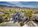 Expansive estate featuring lush landscaping, a large circular driveway, and breathtaking mountain views at 1800 Melfi Ct, Henderson, NV 89012