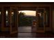 Serene balcony featuring an outdoor fireplace, views, and an open doorway into a luxury home at 1800 Melfi Ct, Henderson, NV 89012