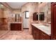 Primary bathroom with dual sinks, vanity, and glass enclosed shower at 1800 Melfi Ct, Henderson, NV 89012