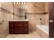 Bathroom featuring marble countertops, jacuzzi tub, and decorative tile-work at 1800 Melfi Ct, Henderson, NV 89012