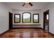 Bedroom features hardwood flooring, recessed lighting, an abundance of windows and a bench seat at 1800 Melfi Ct, Henderson, NV 89012