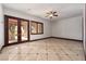 Bedroom with tiled floor, ceiling fan, and access to patio at 1800 Melfi Ct, Henderson, NV 89012