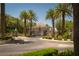 Elegant gated entrance to Roma Hills is lined with palm trees and manicured landscaping, enhancing its appeal at 1800 Melfi Ct, Henderson, NV 89012