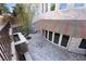 Aerial view of a courtyard features stone walls, a fireplace, and striped awning providing shade at 1800 Melfi Ct, Henderson, NV 89012