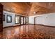 Large living room features unique wood floors, wood ceiling, and natural lighting at 1800 Melfi Ct, Henderson, NV 89012