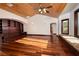 Open living room with wood ceiling, custom built-in shelving and window seat at 1800 Melfi Ct, Henderson, NV 89012